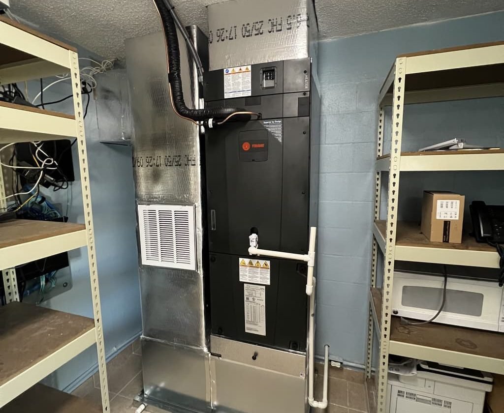 Florida Aire technician servicing an HVAC system in Fort Myers